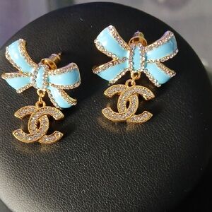 Elegant Blue Bow Earrings with Gold Accents